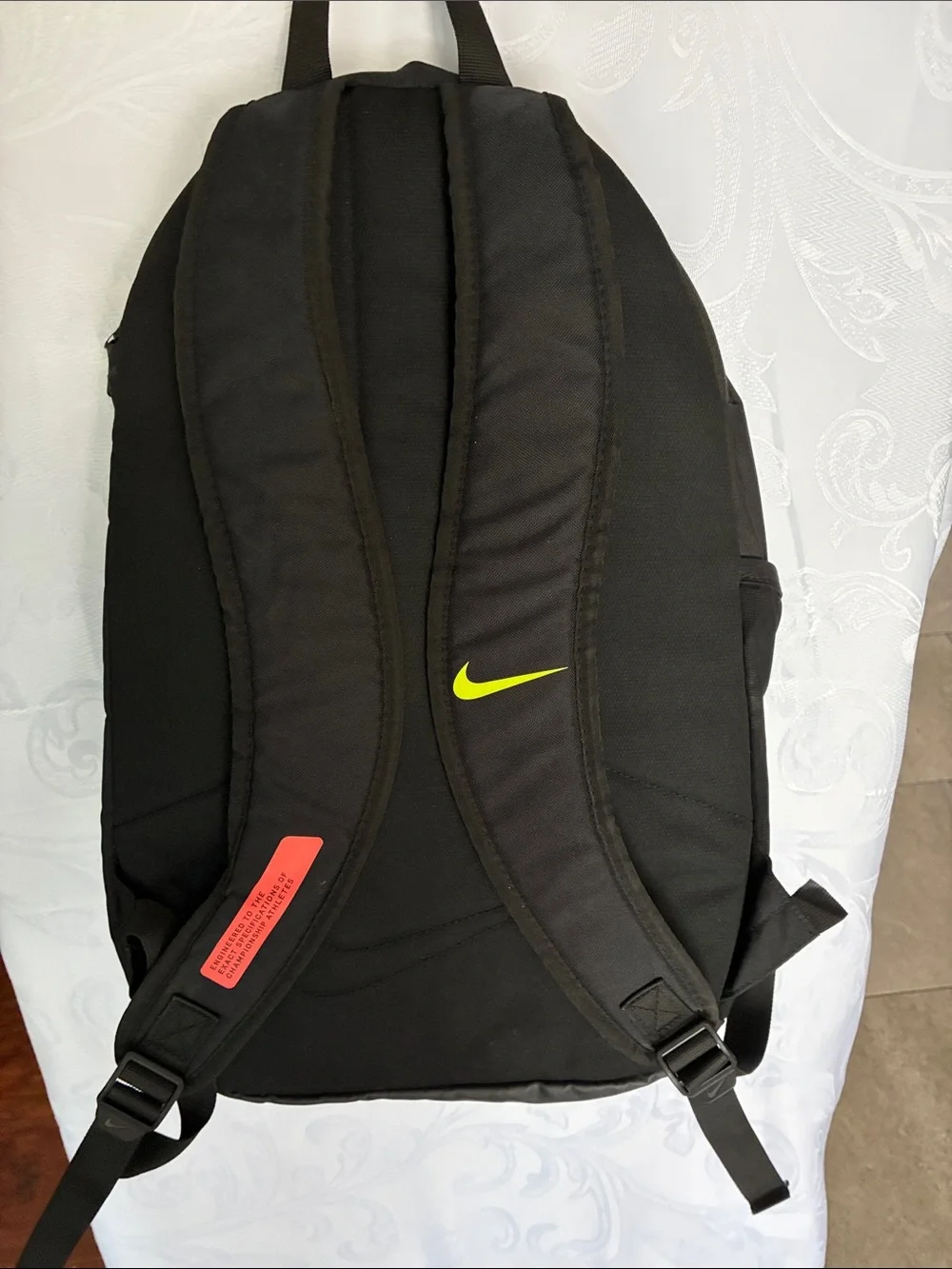 Nike Black Backpack with Neon Yellow Swoosh and Red Stripe Accents